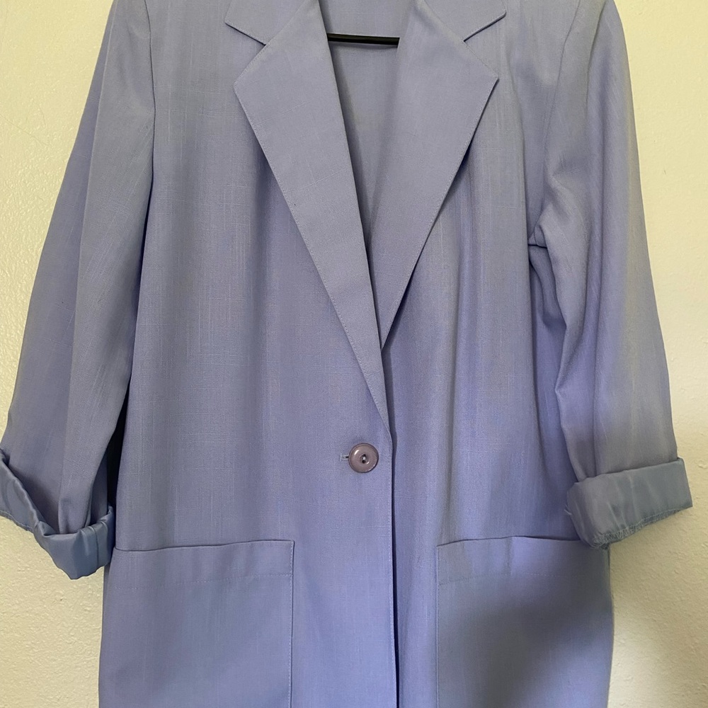 3/4 length sleeve over size blazer. Pastel green. Falls below butt. For spring.